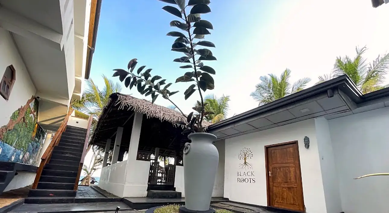 Shaded courtyard and thatched pavilion at CanRoyal Resort, Tangalle